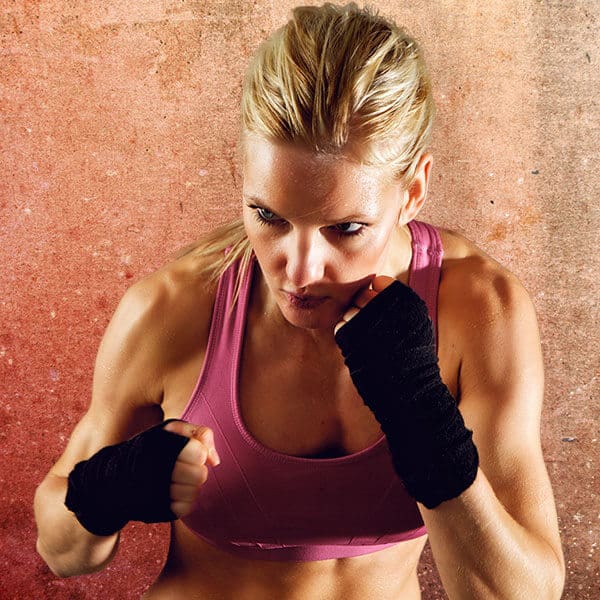 Mixed Martial Arts Lessons for Adults in Fort Dodge IA - Lady Kickboxing Focused Background
