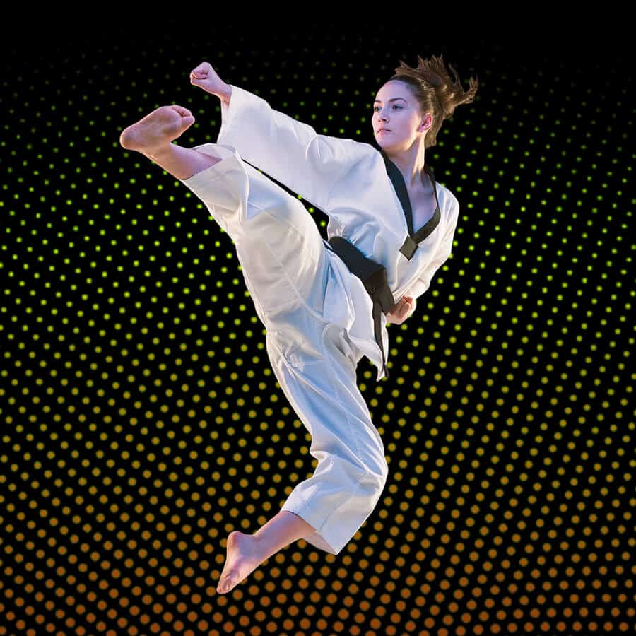 Martial Arts Lessons for Adults in Fort Dodge IA - Girl Black Belt Jumping High Kick