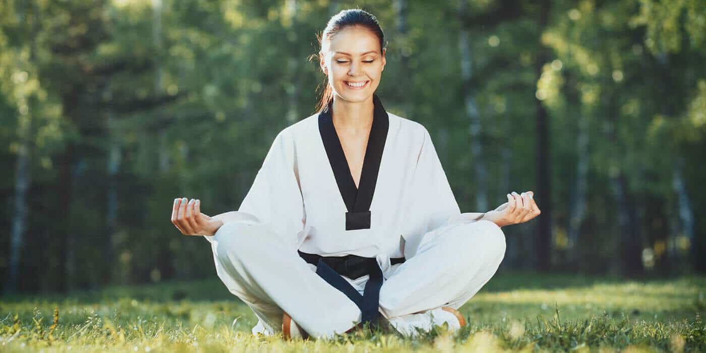 Martial Arts Lessons for Adults in Fort Dodge IA - Happy Woman Meditated Sitting Background