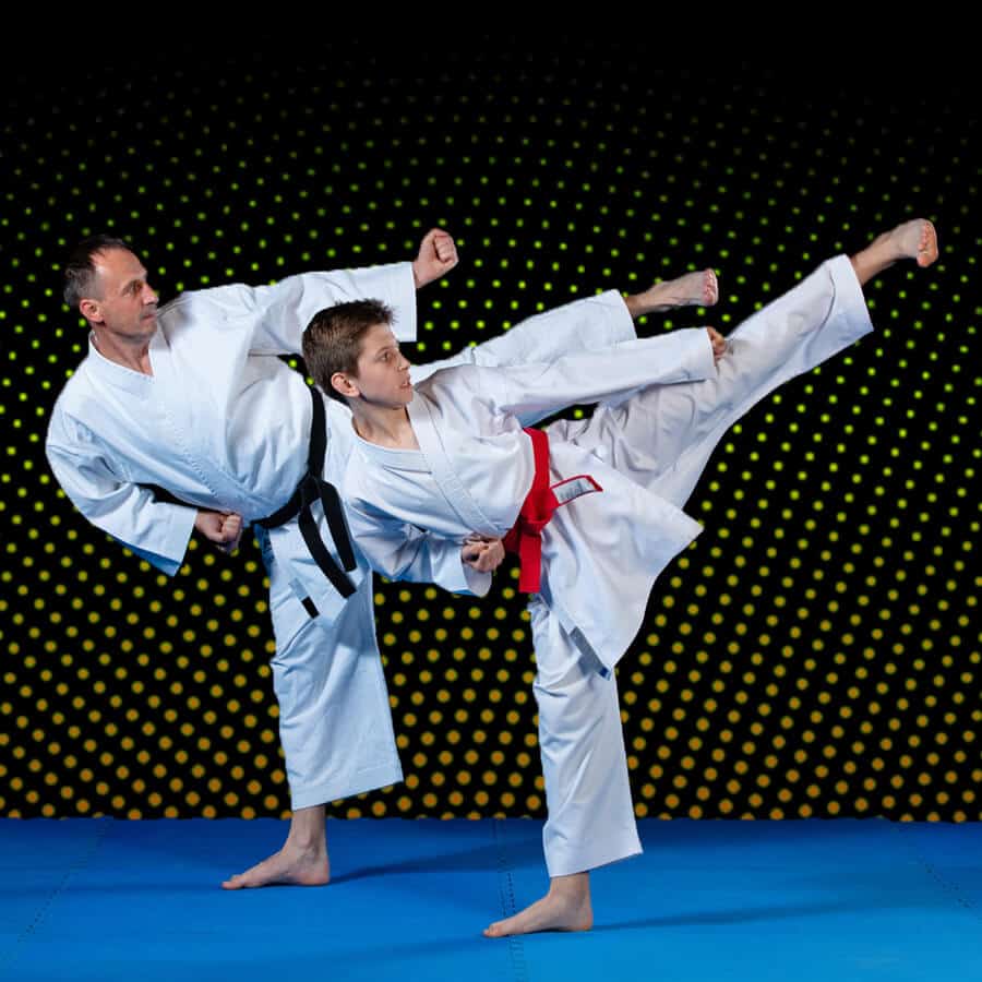 Martial Arts Lessons for Families in Fort Dodge IA - Dad and Son High Kick
